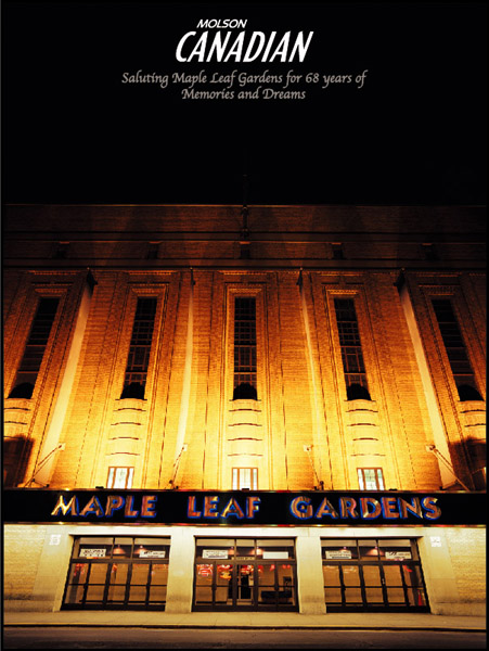 A lit up building with the words maple leaf gardens written on it.
